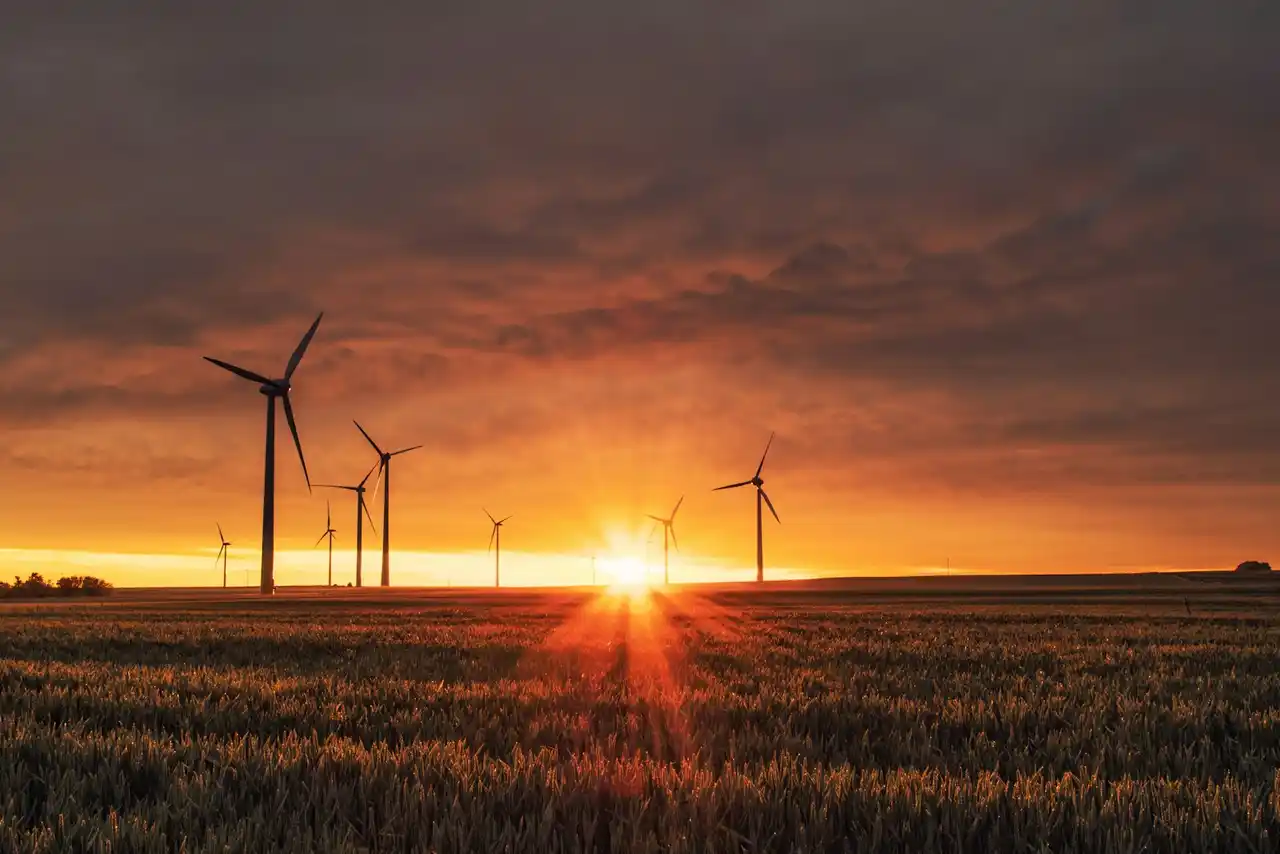 Wind turbines on an energy site at dusk
